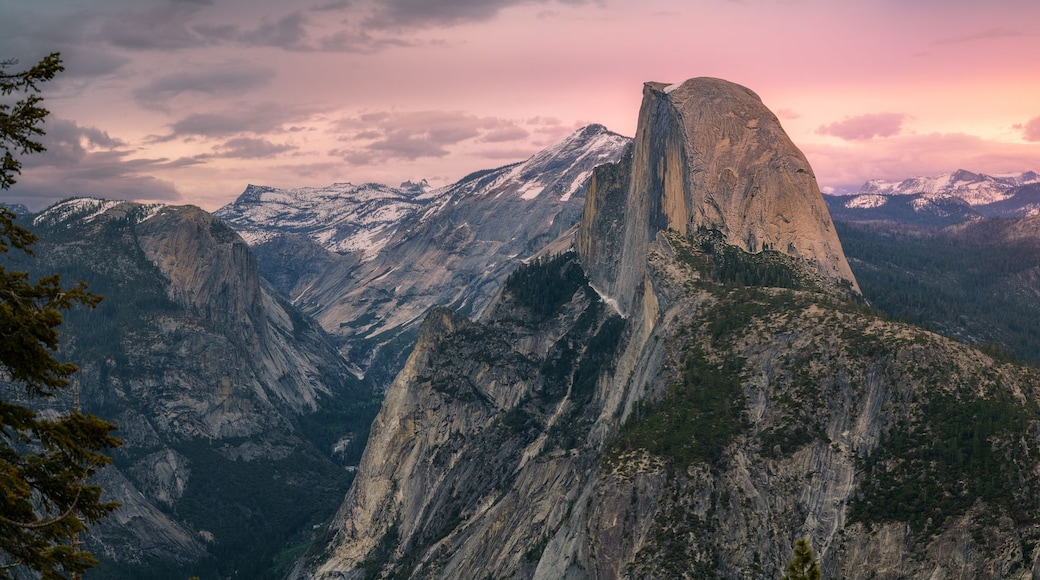 half dome and waterfalls from glacier point in yosemite national park at sunset