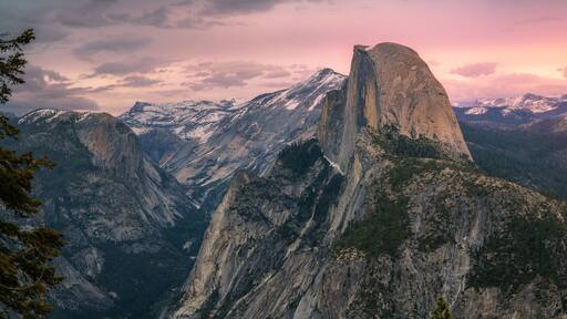 half dome and waterfalls from glacier point in yosemite national park at sunset