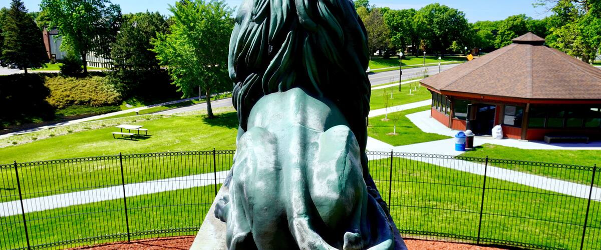 Lion on the Hermann Heights Monument in New Ulm, Minnesota. Herman or Hermann the German statue was built in 1897. The originally designed lions were not added until 2001. Copper statue on pedestal.