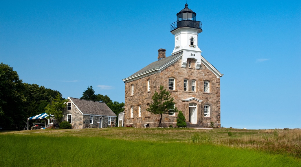 Sheffield Island lighthouse on a summer day in Connecticut. It is located on one of the Norwalk islands and hosts many events for tourists.