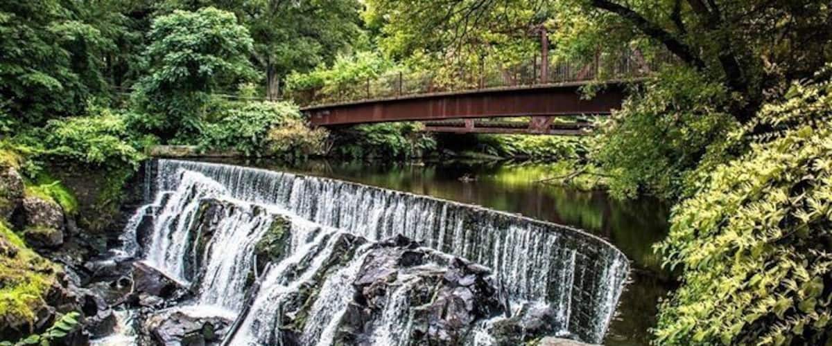 Yantic Falls Indian Leap in Norwich.. Yantic Falls is located on the Yantic River northwest of downtown Norwich, dropping 40 feet through a narrow slot now spanned by a railroad bridge and a footbridge. Good for urban hiking but a pretty waterfall to look at! #nature