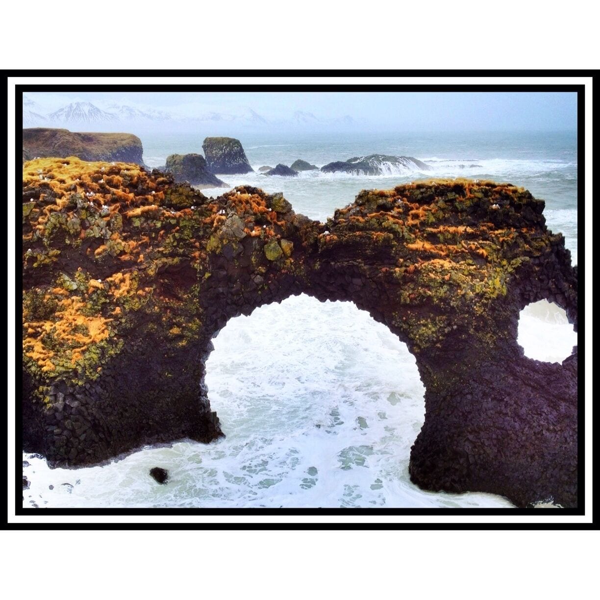 Near Olafsvik on the north side of the Snaefellsness peninsula you'll see a large statue of a Norseman.  Park in that lot and take the 5-10 minute walk to the sea where you'll find this beautiful arch.  Be careful not to go too close to the edge of the cliffs as we saw waves break against the cliffs and spray up over them.  Had to be 100 feet up...amazing and powerful!