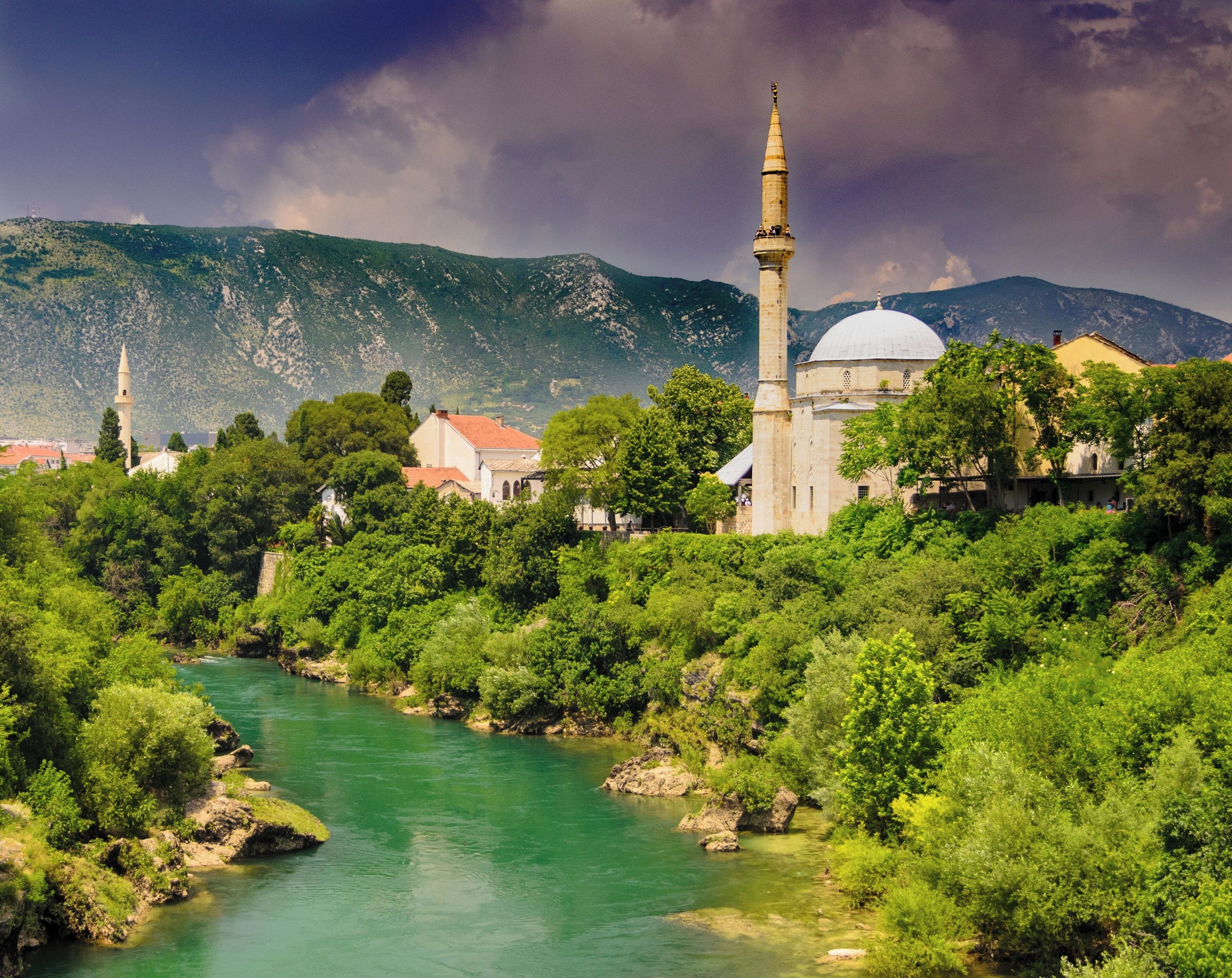 Photograph of Koski Mehmed Paša Mosque along the Neretva River.  Photograph taken from the Stari Most (Old Bridge) in Mostar.