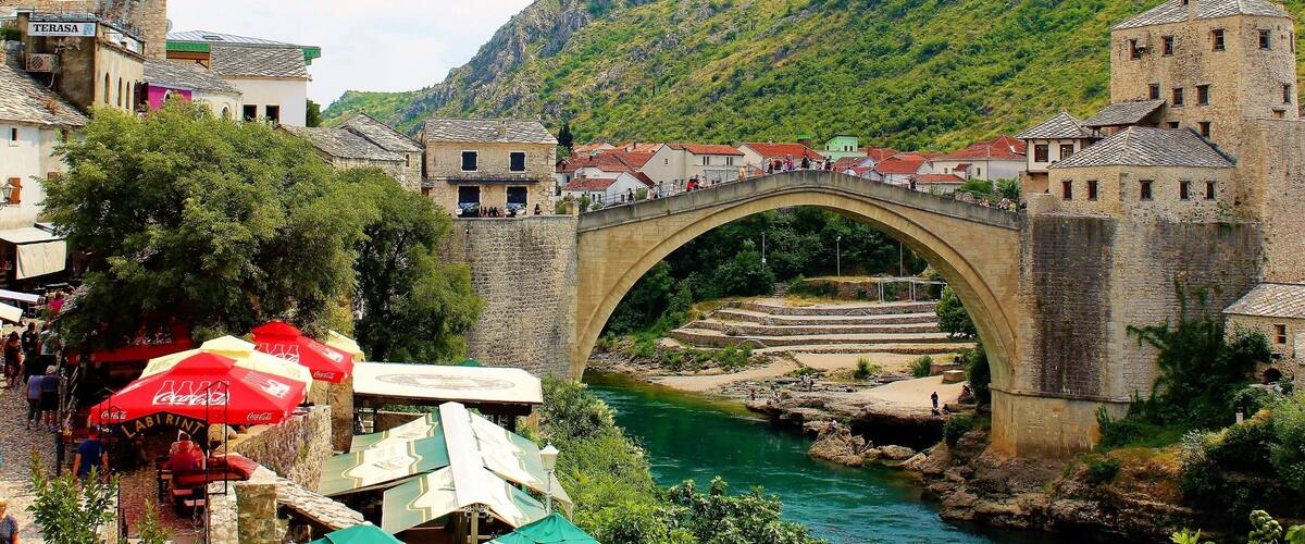 Stari Most (Old Bridge), one of the most famous landmarks in Bosnia & Herzegovina. It is considered one of the most exemplary pieces of Islamic architecture in the Balkans. It was built in the 16th century, tragically destroyed in 1994 but rebuilt in 2004. It's an absolute must-see for anyone visiting Bosnia & Herzegovina. Or for anyone visiting Dubrovnik, Croatia! And Mostar, the cultural capital of Herzegovina region, is one of the most historically diverse cities in Europe. Today it is about half Croatian and half Bosniak. In the past there were also a significant amount of Serbs. It is really amazing to see all the diverse architecture! Which includes much Ottoman influence. But, the nature is incredible, as well! The mountains in the background and the river through the city! And all of the greenery around! Truly a remarkable city to visit!