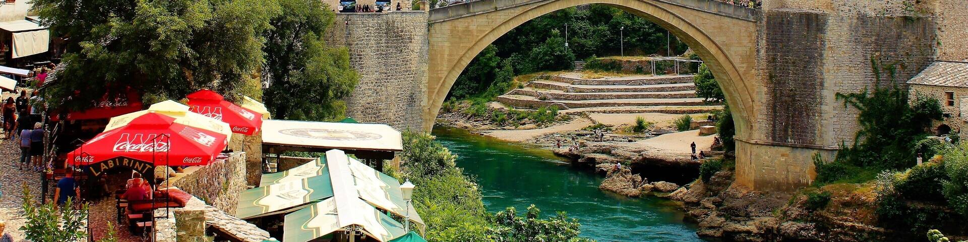 Stari Most (Old Bridge), one of the most famous landmarks in Bosnia & Herzegovina. It is considered one of the most exemplary pieces of Islamic architecture in the Balkans. It was built in the 16th century, tragically destroyed in 1994 but rebuilt in 2004. It's an absolute must-see for anyone visiting Bosnia & Herzegovina. Or for anyone visiting Dubrovnik, Croatia! And Mostar, the cultural capital of Herzegovina region, is one of the most historically diverse cities in Europe. Today it is about half Croatian and half Bosniak. In the past there were also a significant amount of Serbs. It is really amazing to see all the diverse architecture! Which includes much Ottoman influence. But, the nature is incredible, as well! The mountains in the background and the river through the city! And all of the greenery around! Truly a remarkable city to visit!