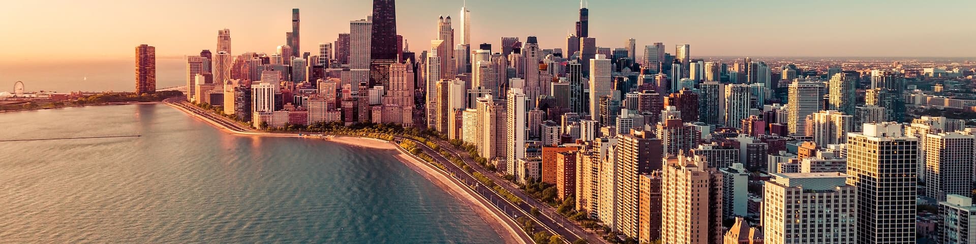 Chicago skyline aerial view with light effect applied. Sunrise above downtown buildings and Lake Michigan