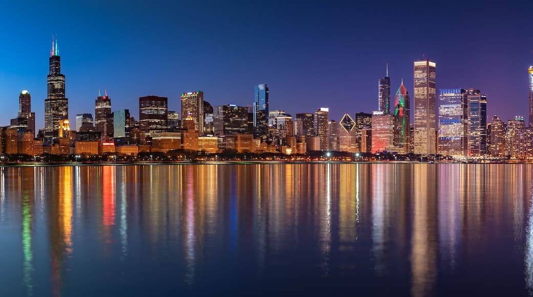 Chicago Skyline Cityscape at night with lake in front and blue sky with cloud, Chicago, United state.