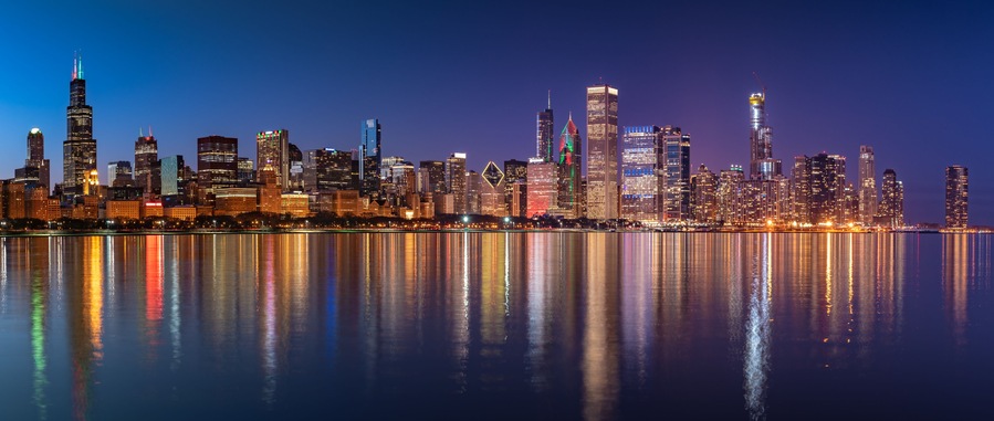 Chicago Skyline Cityscape at night with lake in front and blue sky with cloud, Chicago, United state.