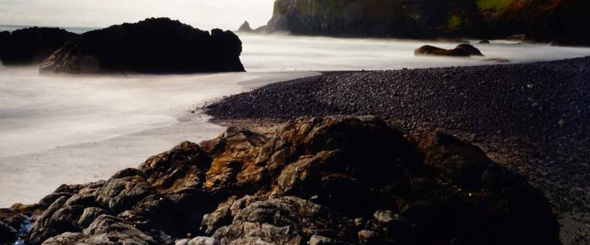 Beautiful Yaquina Bay lighthouse from Cobble Beach.
