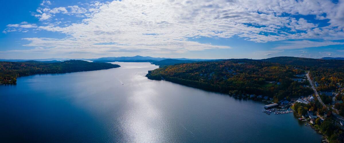 Panoramic aerial view of Meredith Bay in Lake Winnipesaukee in fall from town center of Meredith, New Hampshire NH, USA.