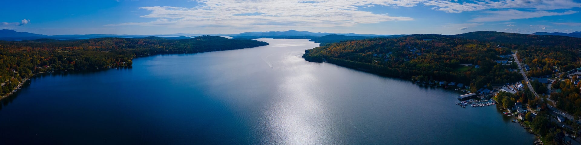 Panoramic aerial view of Meredith Bay in Lake Winnipesaukee in fall from town center of Meredith, New Hampshire NH, USA.