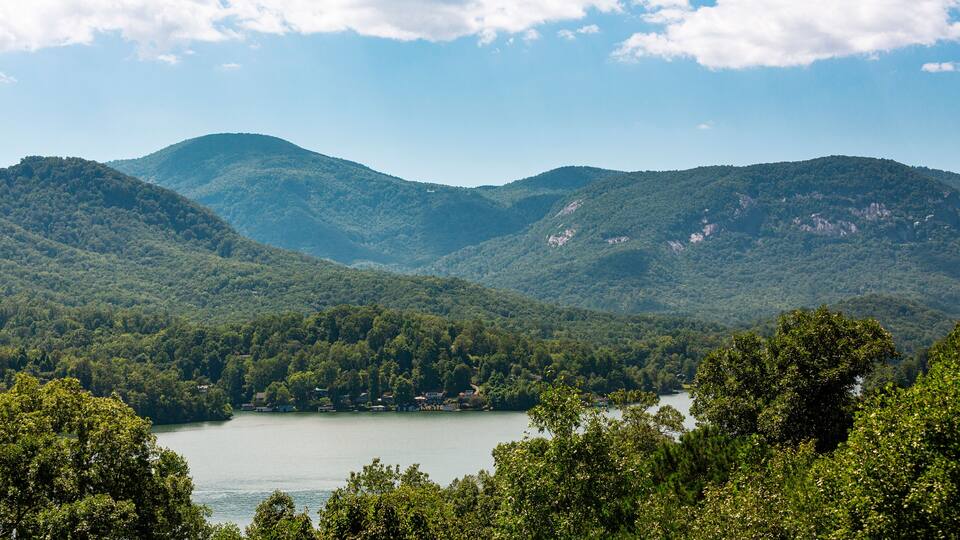Lake Lure, NC Aerial Above View Of Lake and Chimney Rock Mountain