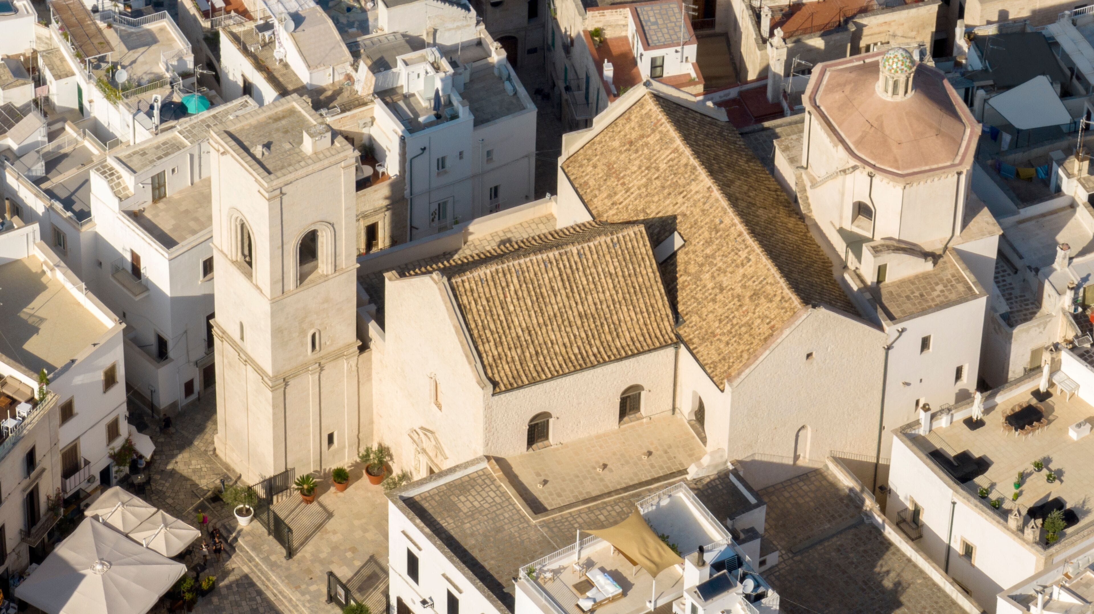 Aerial view of the Mother Church of Santa Maria Assunta located in Polignano a Mare, in the province of Bari, Puglia, Italy. It is the church of the historic center of the town.