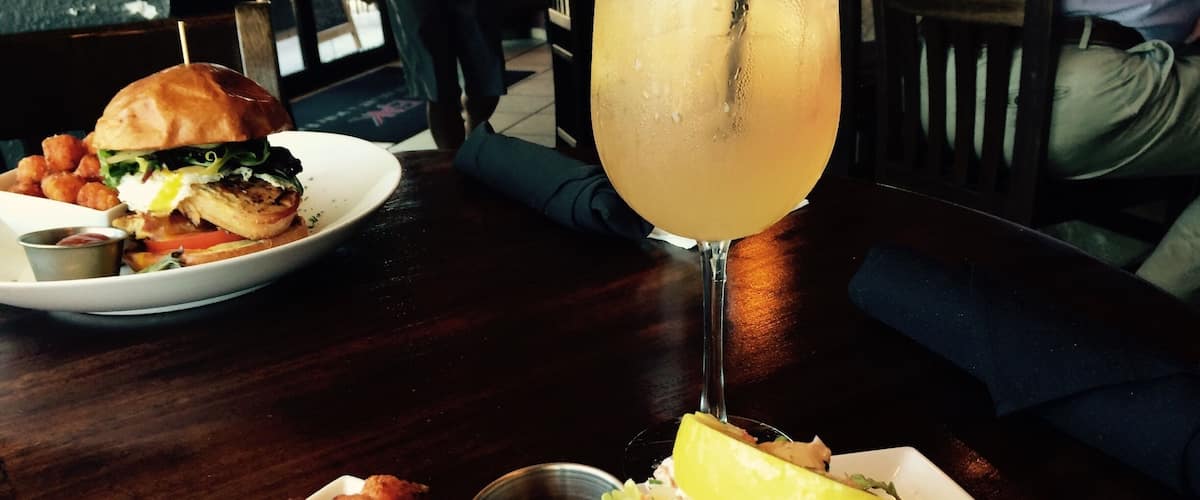 Holy Flavor explosion! Lobster Roll sandwich...Maine lobster tossed in creamy herb citrus sauce with chopped romaine lettuce served in a warm toasted brioche roll and a side of sweet potato tater tots. Paired with a refreshing peach Sangria. This place is a must when you are in Ocoee.