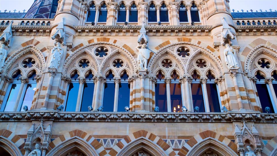 A Gothic-style building with intricate stone carvings and pointed arches.
