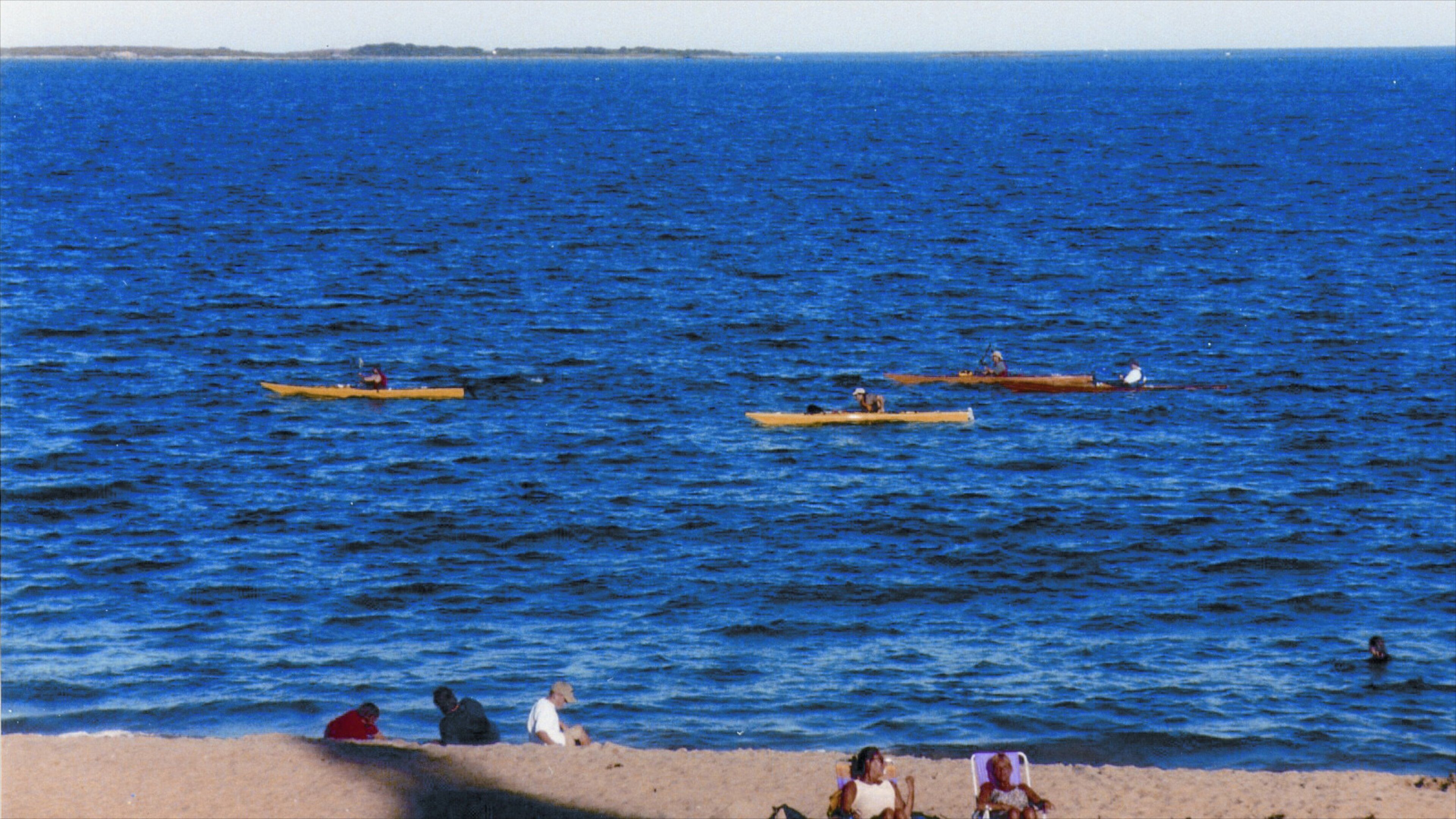 Old Orchard Beach which includes kayaking or canoeing and a sandy beach as well as a small group of people