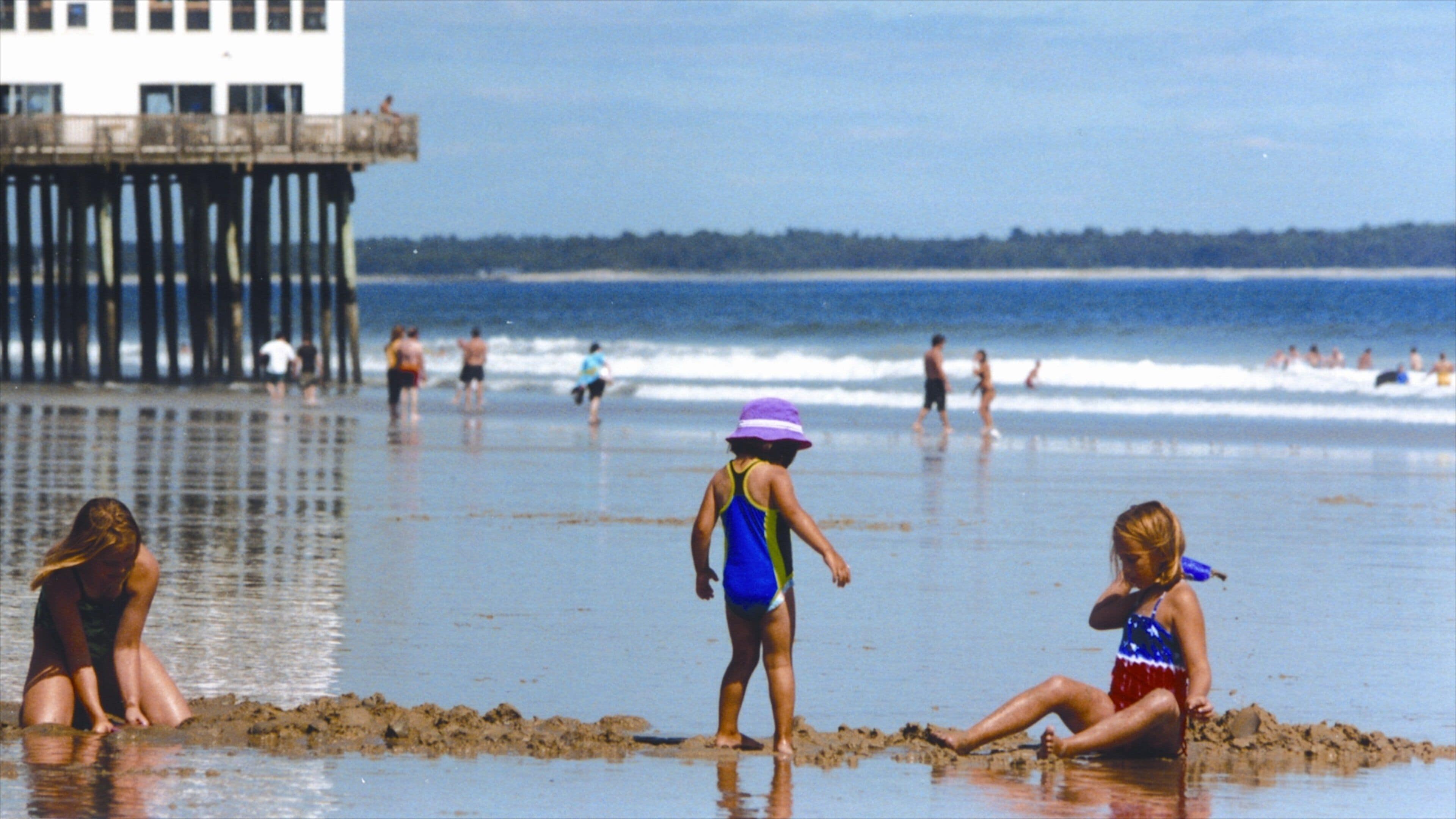 Old Orchard Beach which includes a beach and a coastal town as well as children