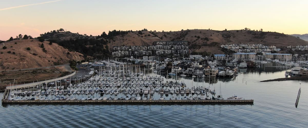 Drone shot of boats marina on the shore of Lake Oroville at sunset in California