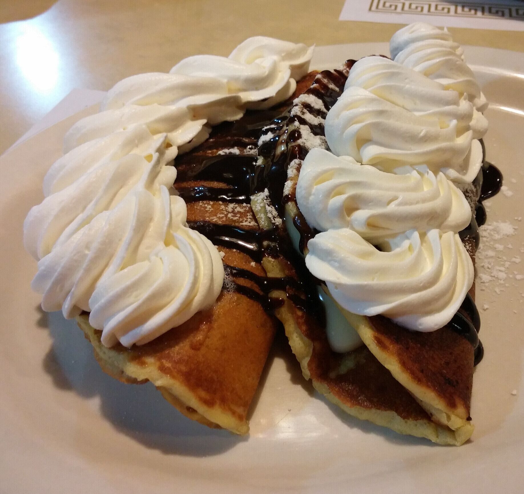 Eclair pancakes - buttermilk pancakes filled with vanilla pudding, folded over and topped with powdered sugar, chocolate syrup and whipped cream. 

The breakfast and the burgers are great choices from the 24 hour Free-Way Drive In, although the name may be a misnomer. It is located near a free-way but it has been a long time since it was actually a drive in.