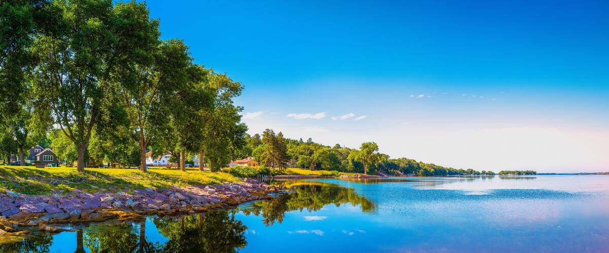 Tranquil sunset forest and marina landscape of Big Stone Lake in Ortonville, Minnesota, USA.