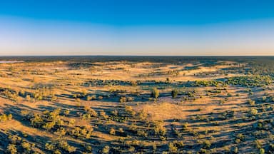 Wide aerial panorama of Australian outback at sunset