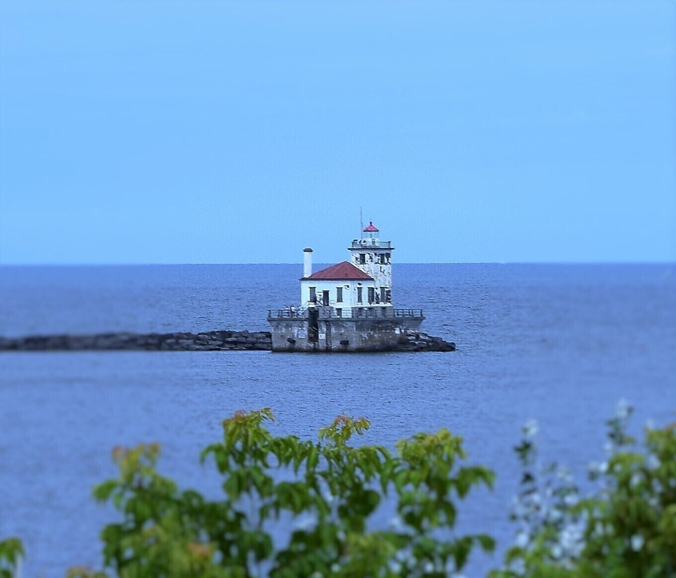 View of the Oswego lighthouse from the grounds of Fort Oswego