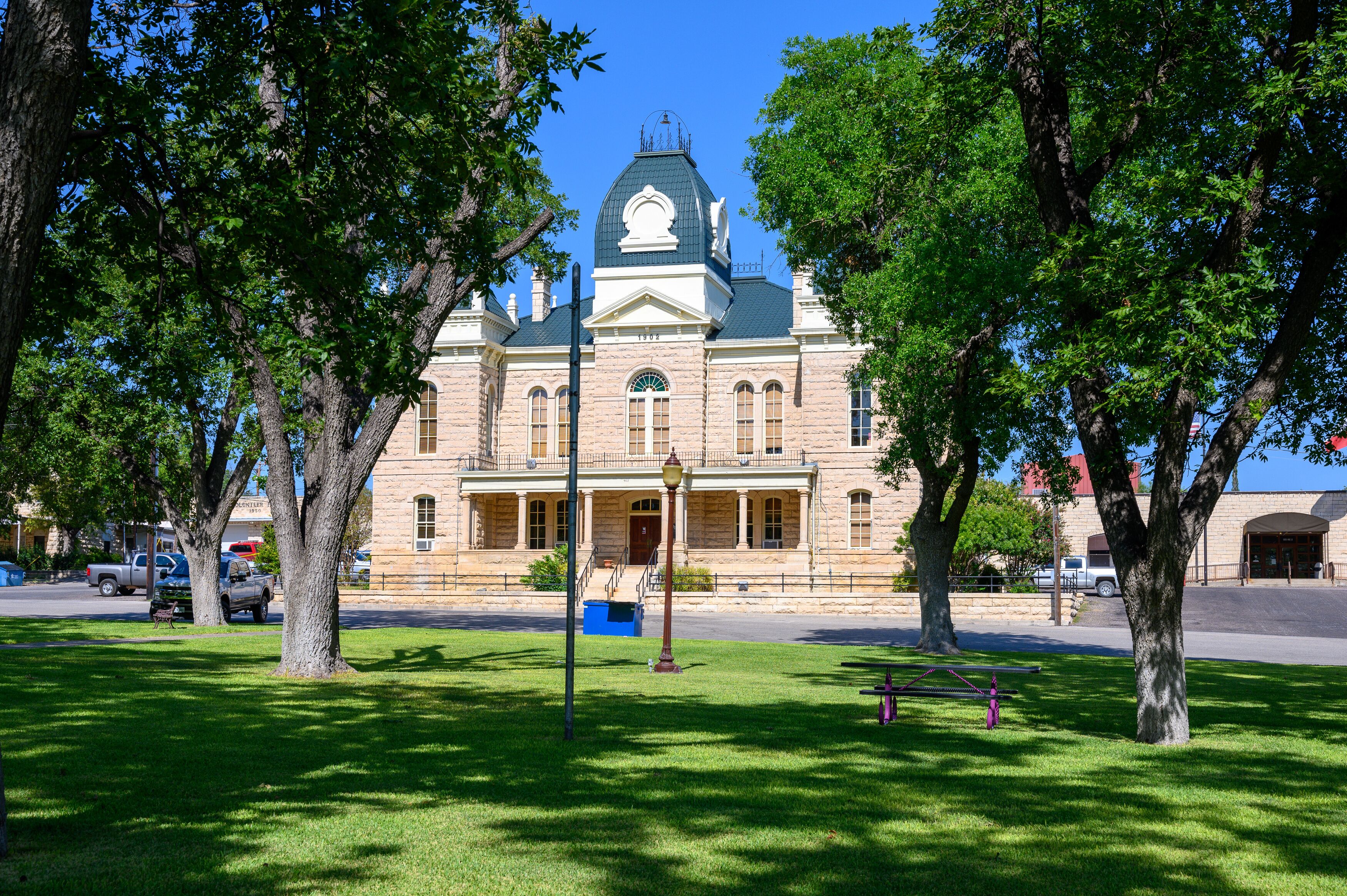 Town Square and Historic Crockett County Courthouse built in 1902. Ozona City in Crockett County in West Texas, United States