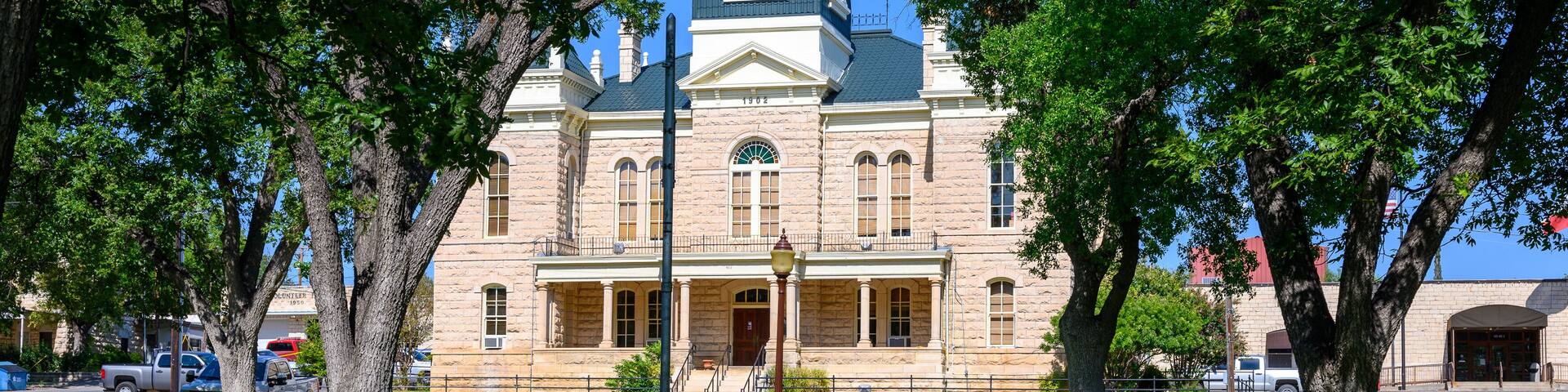 Town Square and Historic Crockett County Courthouse built in 1902. Ozona City in Crockett County in West Texas, United States