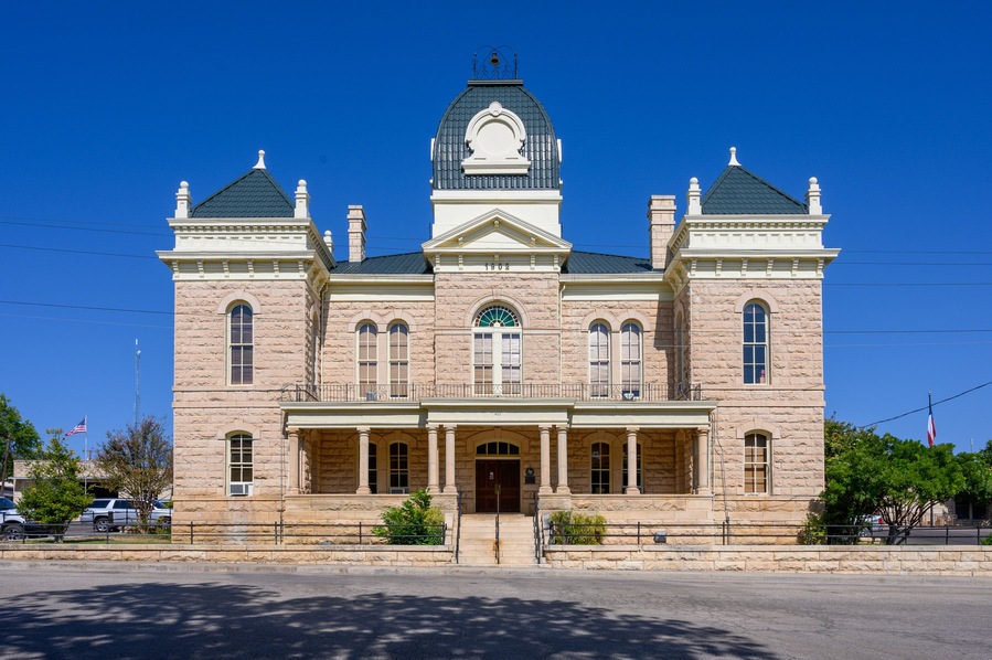 Town Square and Historic Crockett County Courthouse built in 1902. Ozona City in Crockett County in West Texas, United States
