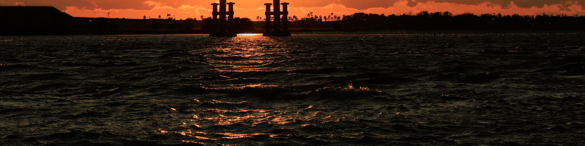 Torii gate silhouette at sunset on New Year's Day, Bentenjima, Hamamatsu, Shizuoka, Japan