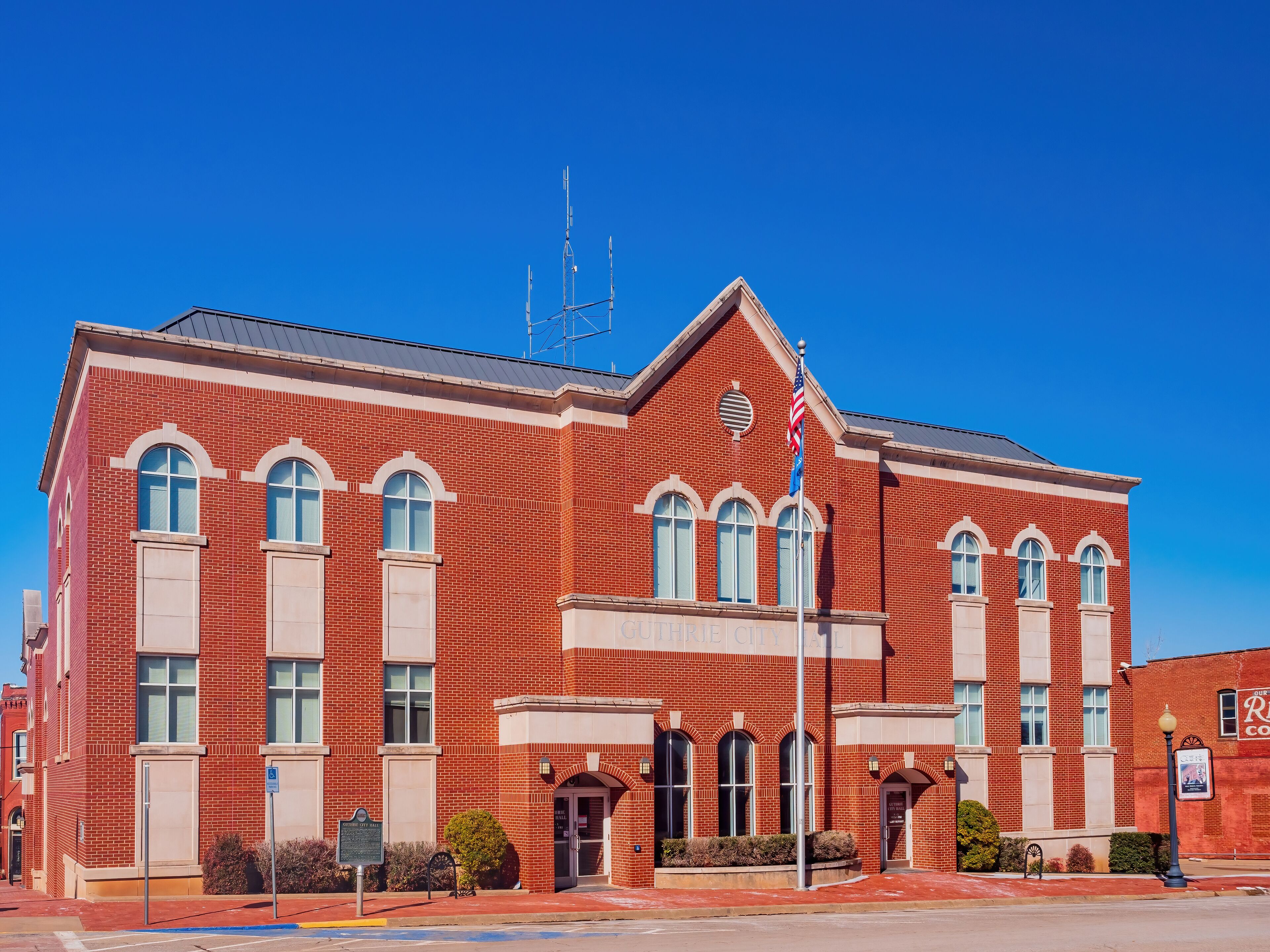 Sunny exterior view of the city hall in Guthrie old town