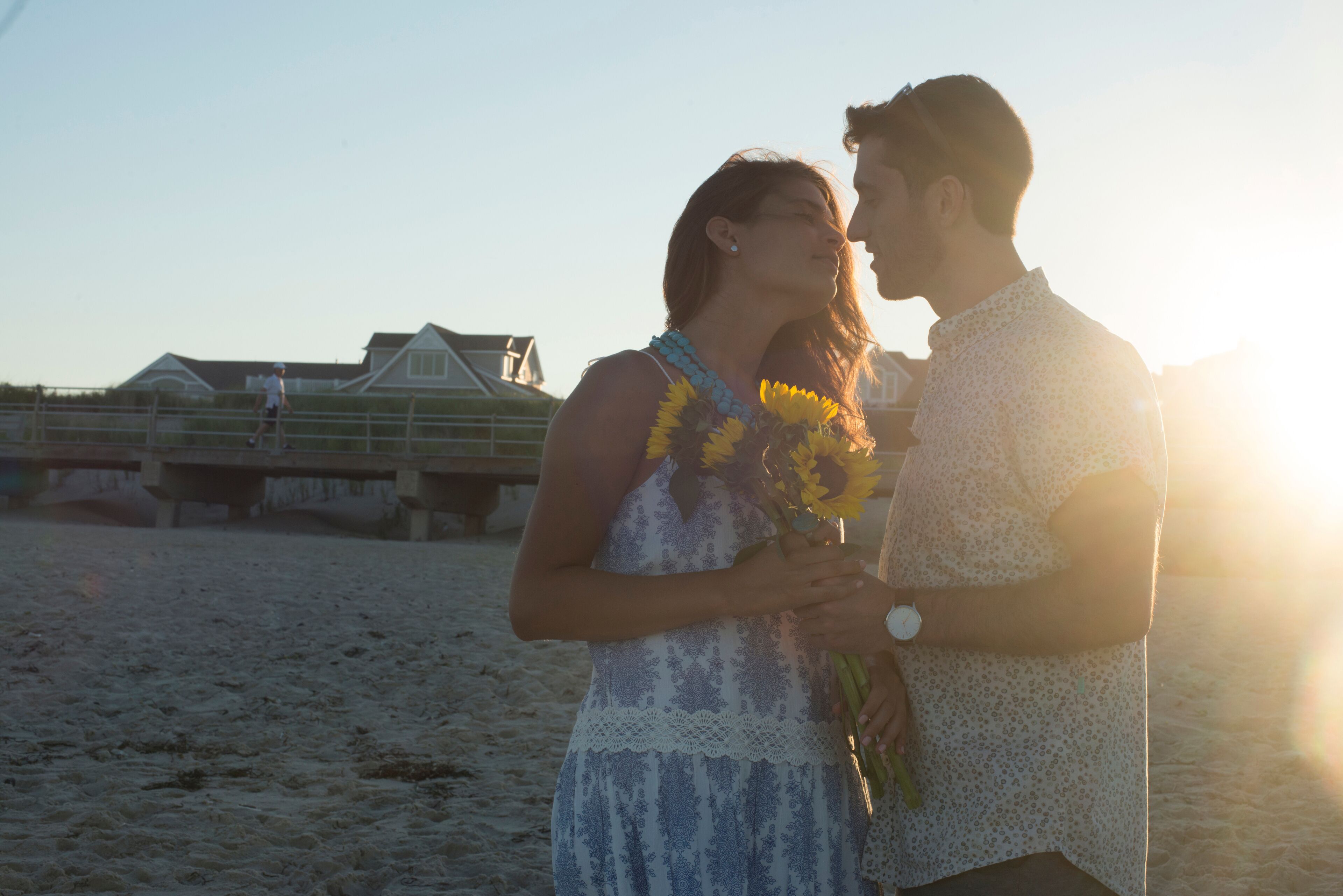 Romantic young couple face to face on beach at sunset,  Spring Lake, New Jersey, USA