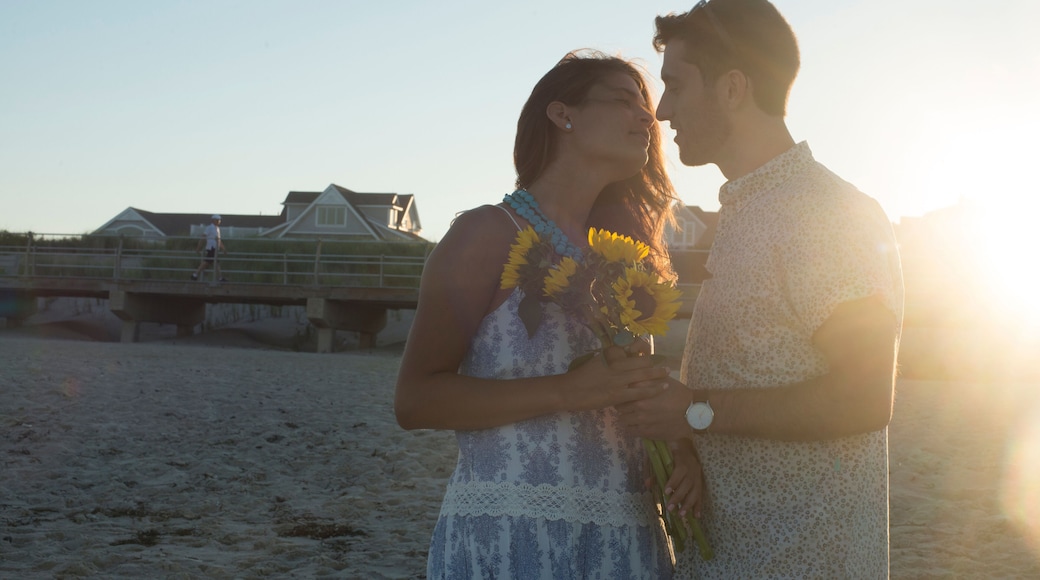Romantic young couple face to face on beach at sunset, Spring Lake, New Jersey, USA