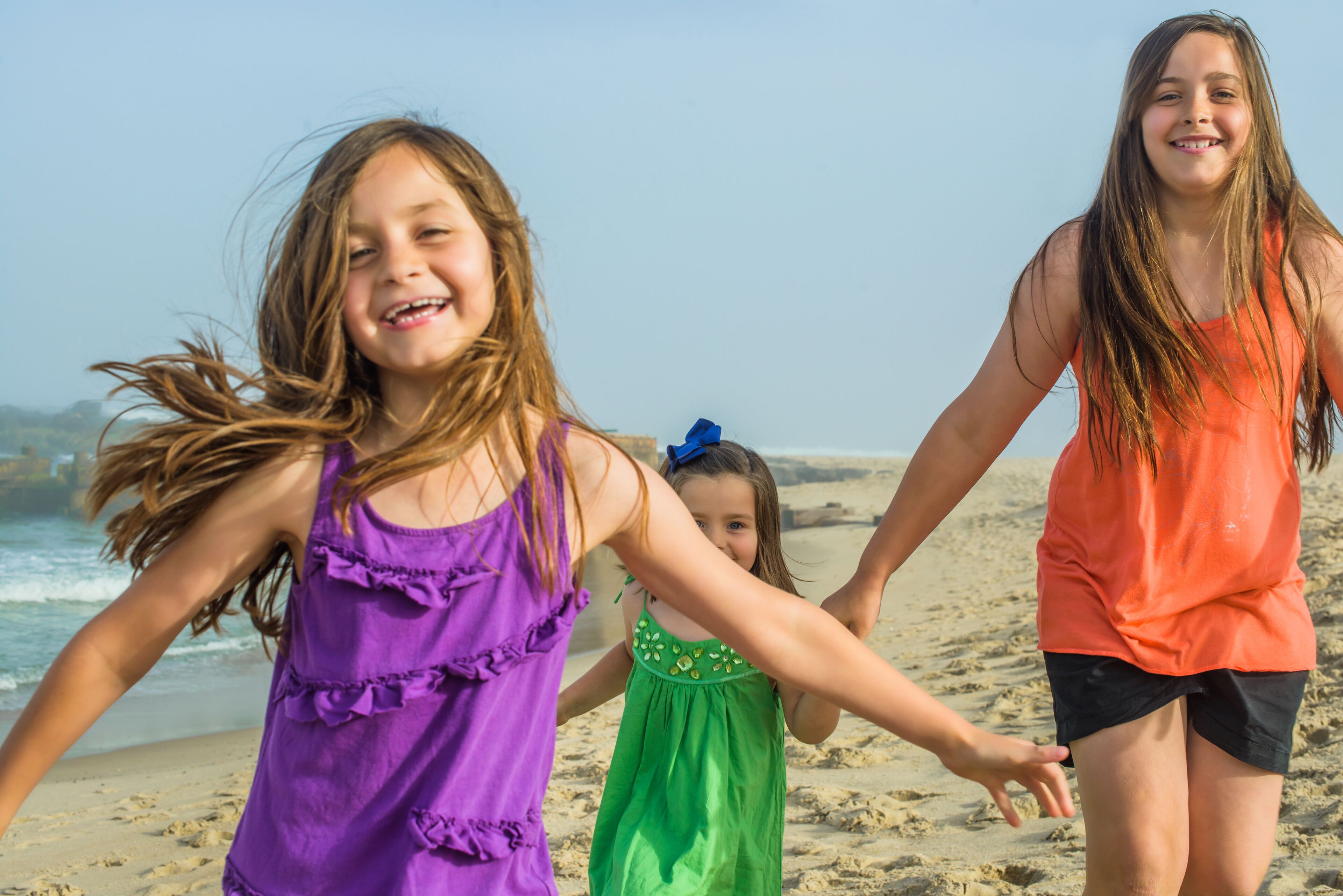 Teenage girl and two sisters on beach, Asbury Park, New Jersey, USA