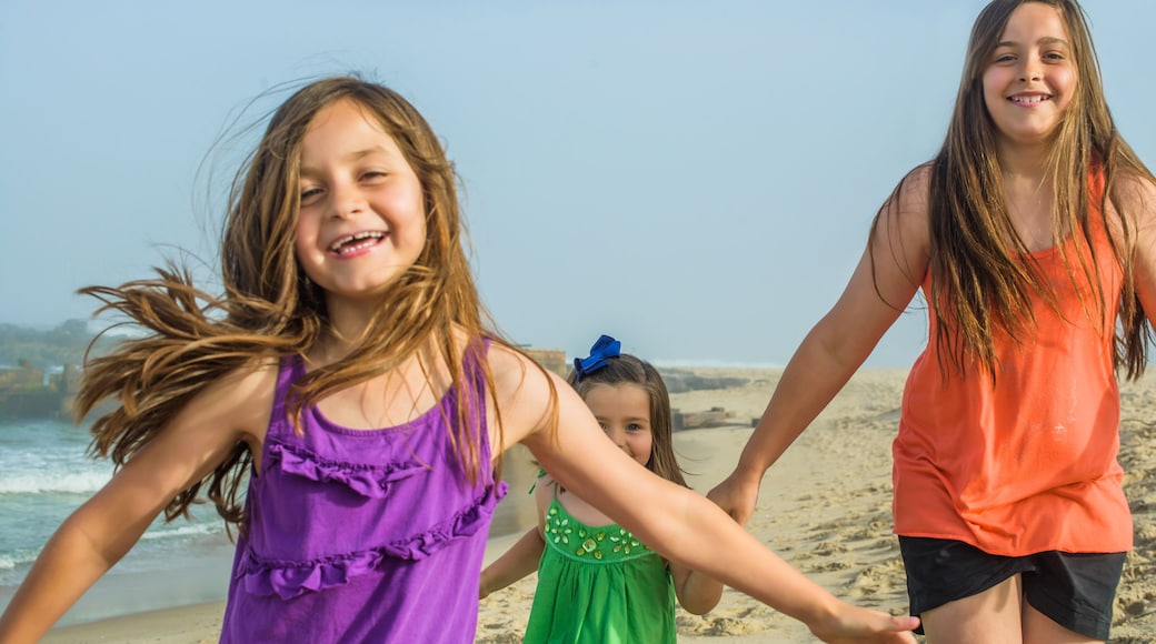 Teenage girl and two sisters on beach, Asbury Park, New Jersey, USA