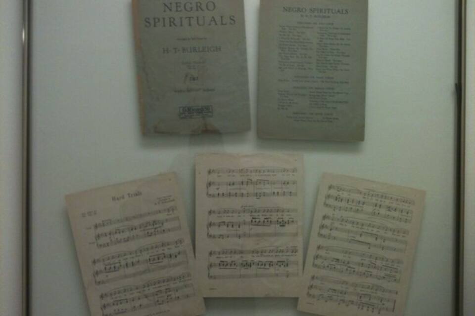 A display of sheet music titled 'Negro Spirituals' and 'Negro Spirituals' by H.T. Burleigh.