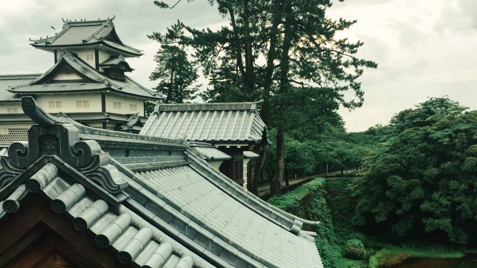 View while walking in Kanazawa castle, Japan. Lots of big black birds here intimidating us. The park is so beautiful and lush, especially in the light rain #japan #castle #architecture
