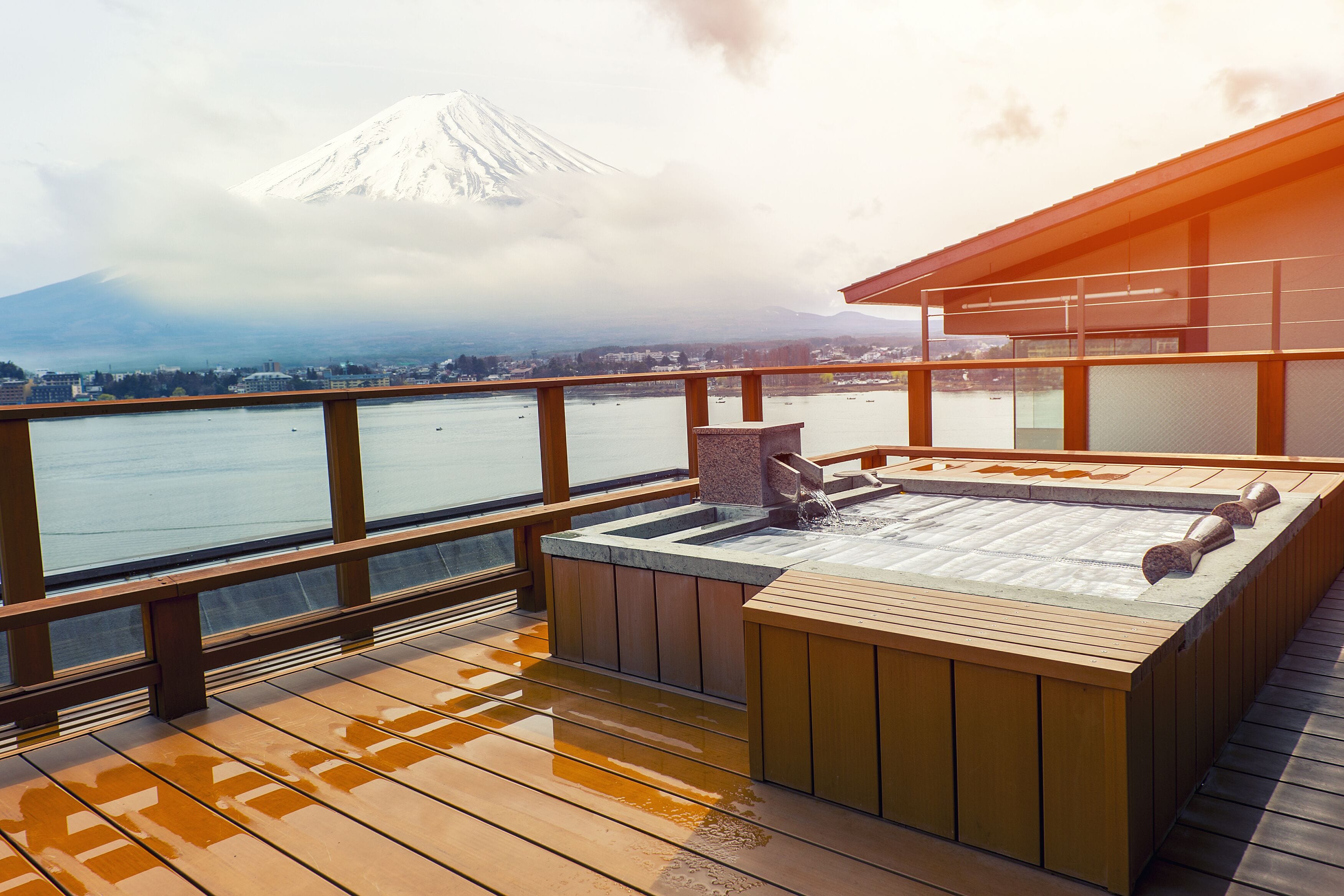 Japanese open air hot spa onsen with view of the mountain Fuji; Shutterstock ID 412828597; Purchase Order: -