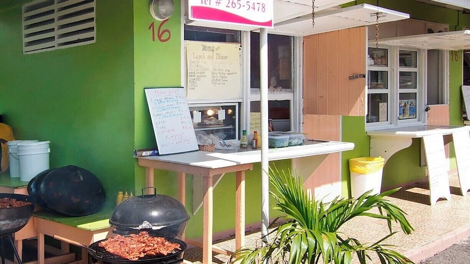 Nelson's Grill House serves up a tasty plate of grilled Caribbean style chicken with your choice of sides. They do their cooking on site and in full view at The Shacks. Stop here for lunch or dinner, and grab a fruity shake a few doors down at A&E Fresh Fruit Juices. Once you have your grub, head over to the covered picnic tables to chow it down.