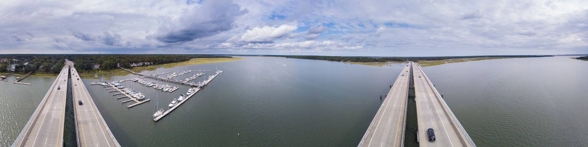 Aerial 360 degree view panorama of coastal highway bridge and marina in South Carolina.