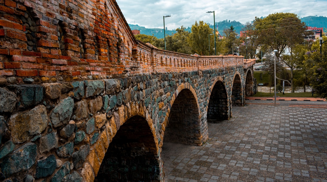 One of the main tourist attractions in the historic center of cuenca, the broken bridge or "El puente roto" in Azuay, Ecuador. Arquitectural heritage in the city downtown with no people. Latin America
