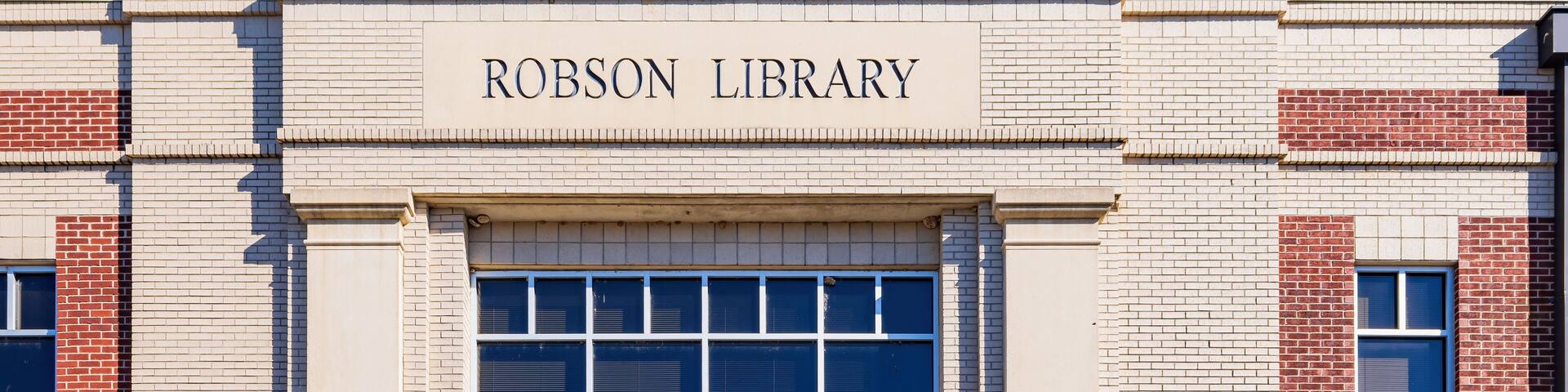 A building with a sign that reads "Robson Library".
