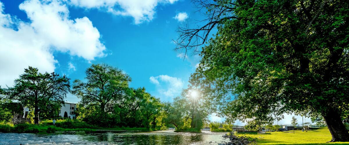 Sunset over a a flowing stream at a local park area in Burlington, Wisconsin USA.