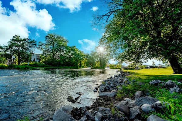 Sunset over a a flowing stream at a local park area in Burlington, Wisconsin USA.