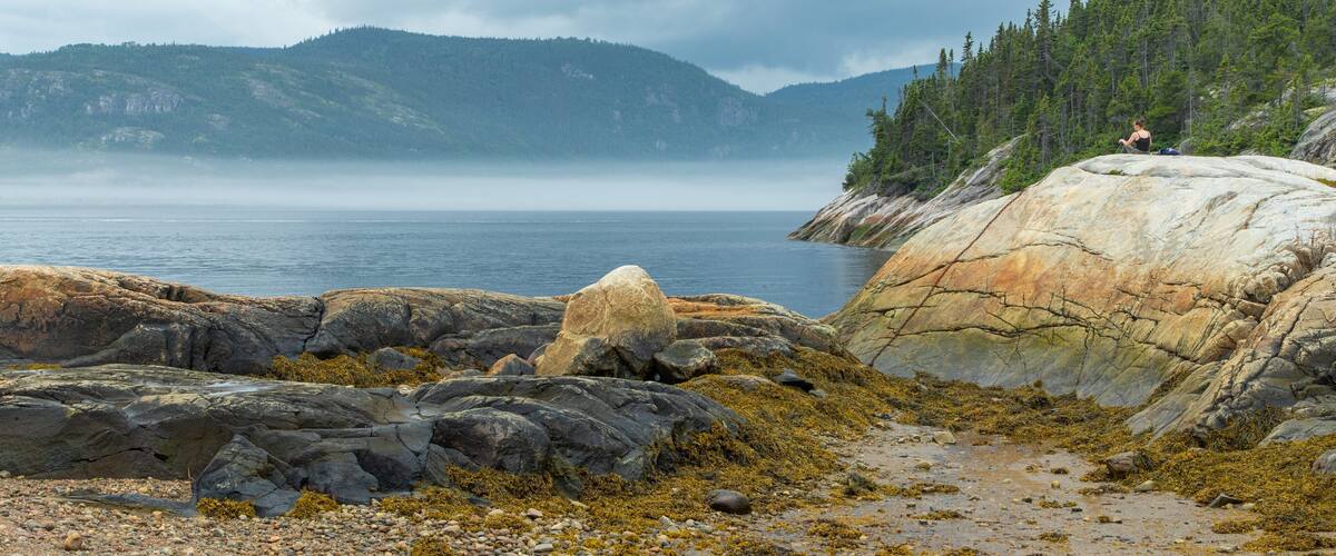 Tadoussac which includes a lake or waterhole