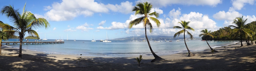 Superb panoramic view of the beautiful beach of Anse à l'Ane near the village of Trois-Ilets in Martinique facing the city of Fort-de-France