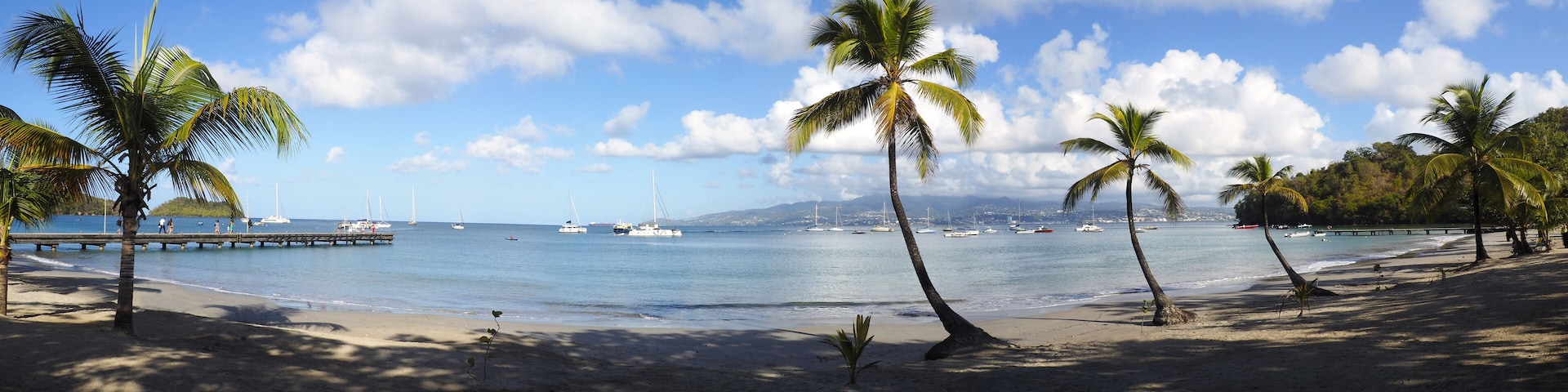 Superb panoramic view of the beautiful beach of Anse à l'Ane near the village of Trois-Ilets in Martinique facing the city of Fort-de-France