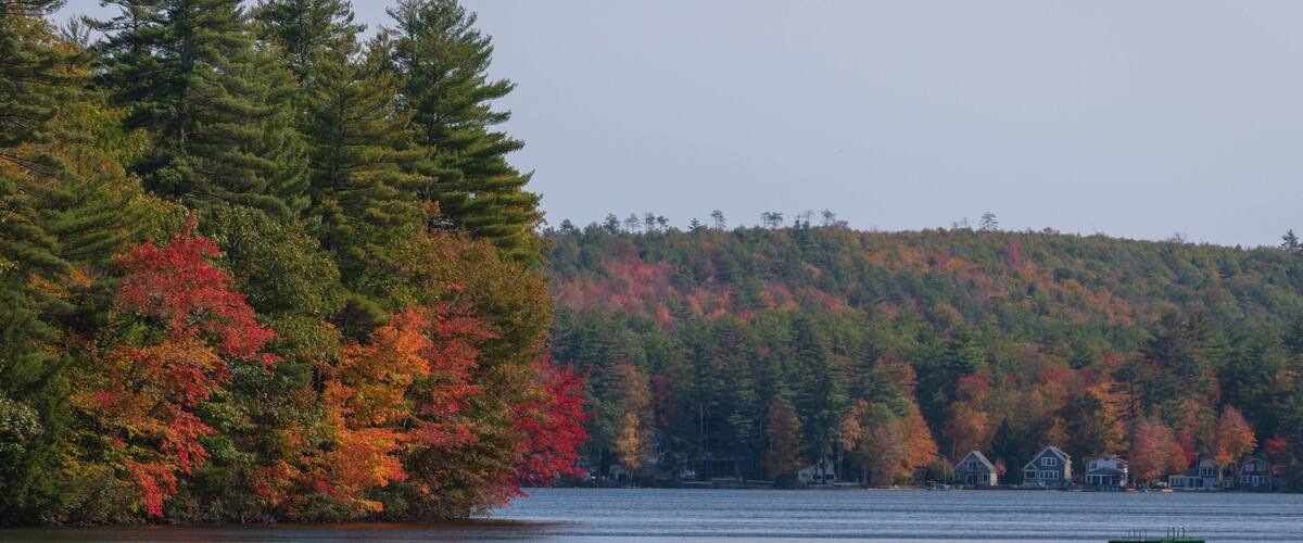 Foliage and boat on Wilson Lake - Acton, Maine.