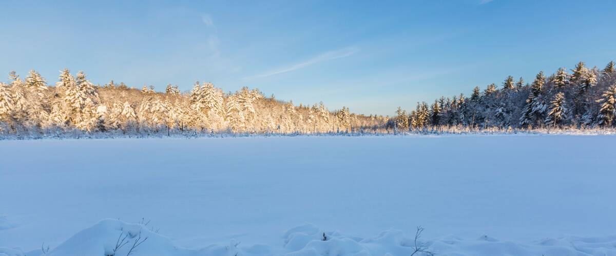 Round Pond in winter at sunrise. Barrington, New Hampshire.