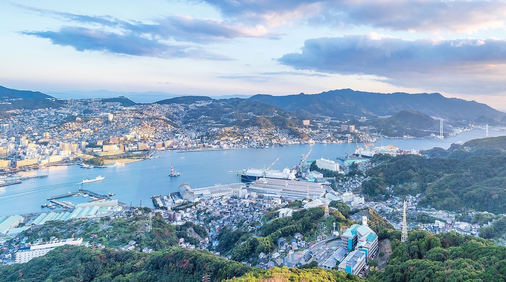 Business concept, modern cityscape of nagasaki dusk from mount inasa, the new top 3 nightview of the world, aerial view, copy space